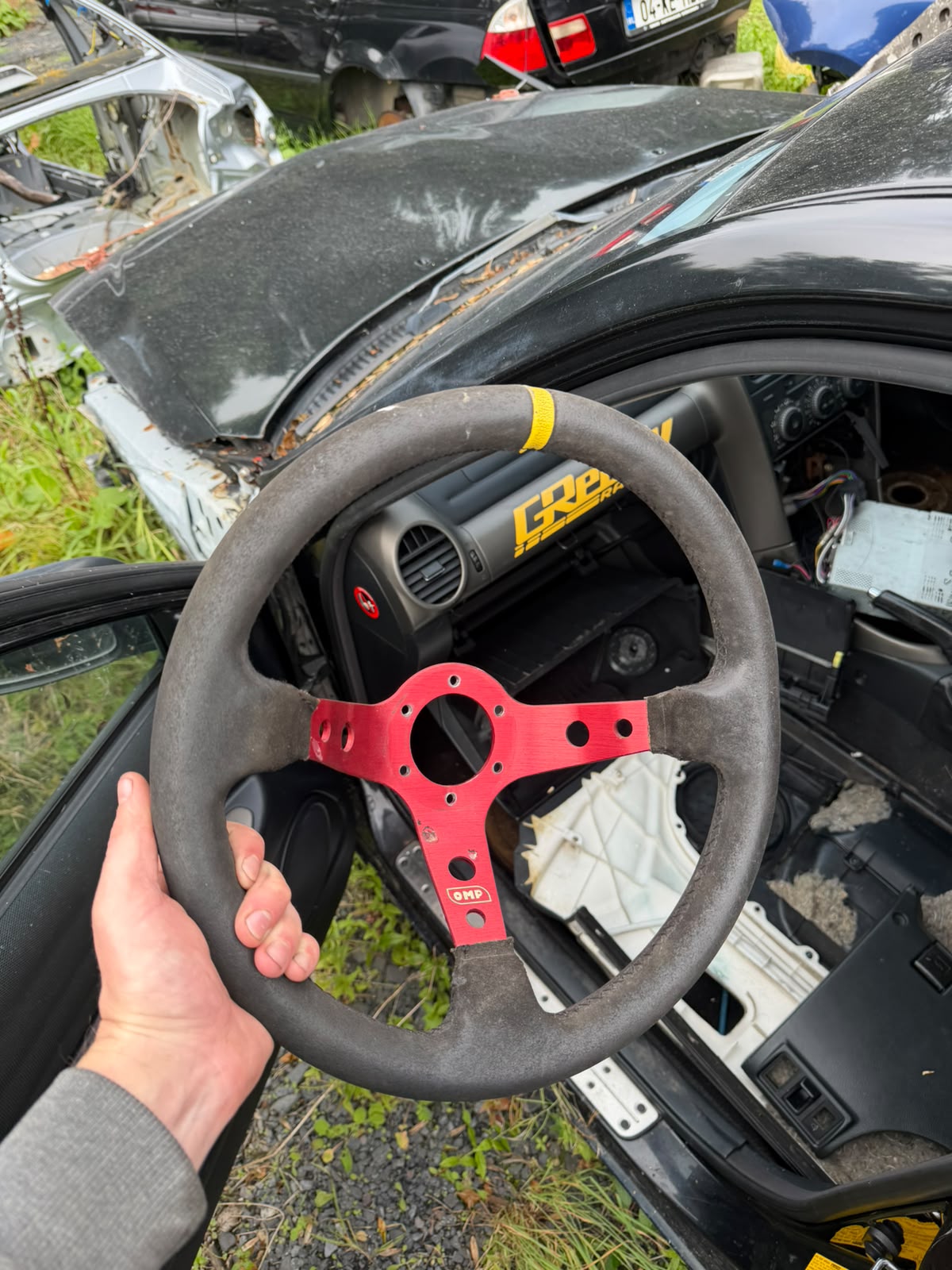 OMP-Branded Red Three-Spoke Steering Wheel